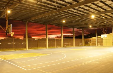 Tagai State Secondary College illuminated at sunset