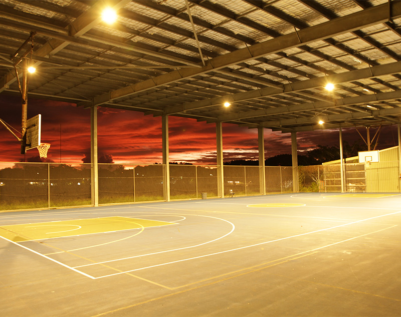 Tagai State Secondary College illuminated at sunset